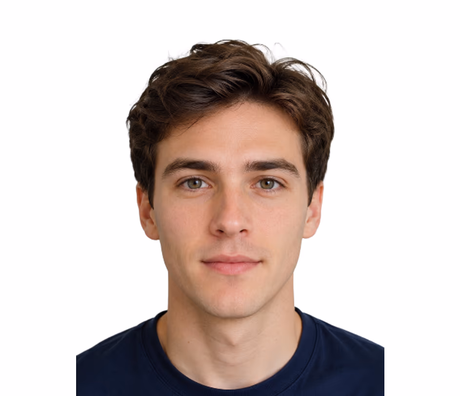 Pro-tier ID photo sample of a male subject with short black hair on a solid white backdrop, wearing a black collared shirt, showing cleaner edge quality from the licensed-data model — suited for passport and government applications