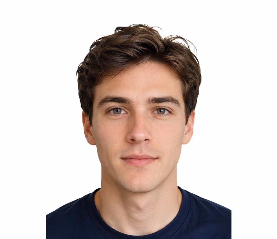 Standard-tier ID photo sample of a young adult male with short dark hair on a solid light-gray backdrop, wearing a plain black t-shirt — typical output for student cards and employee badges