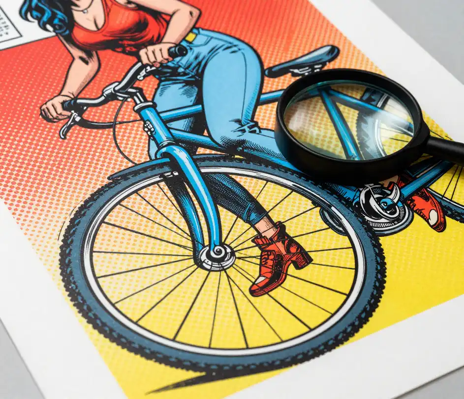 Extreme macro of a printed comic poster showing crisp uniform halftone dot patterns and razor-sharp ink line weight, with a jeweler's loupe resting on the print edge